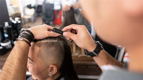 Barber with Razor Finishing Girl Hair at Barber Shop Stock Photo ...