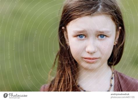 Portrait of sad crying emotional cute little girl looking at camera ...