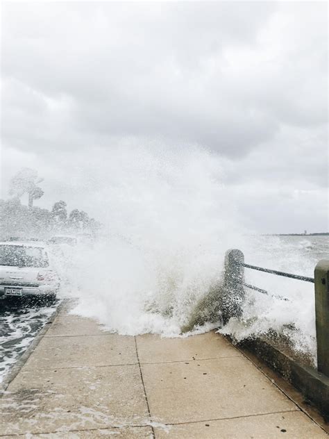 A photo from The Battery this morning . High Tide mixed with Tropical