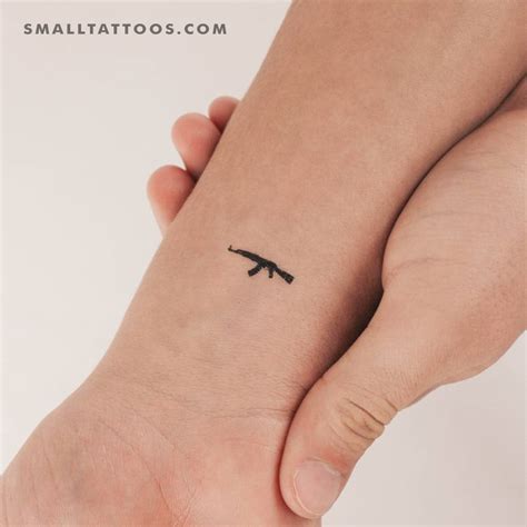 Minimalistic style AK-47 temporary tattoo located on