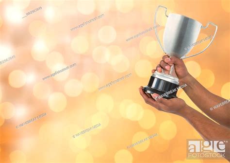 Hands holding trophy against bokeh, Stock Photo, Picture And Royalty ...