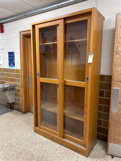 Glass sliding door display case 46'' W by a 16'' | Proxibid