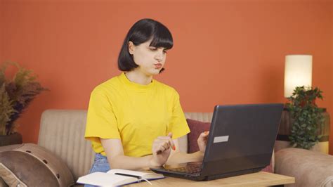 The wrist of the woman using a laptop hurts. 33171393 Stock Video at