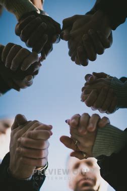 group holding hands  prayer stock  pearl