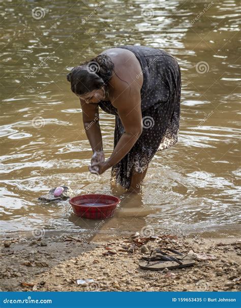 Kataragama, Sri Lanka - 29109-03-29 - Woman Bathes on the Bank of the