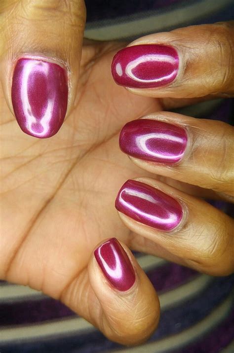 Pink gel nails with metallic powder