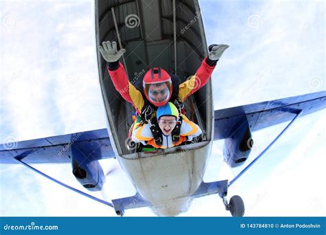 tandem skydiving active woman  jumping    plane stock photo
