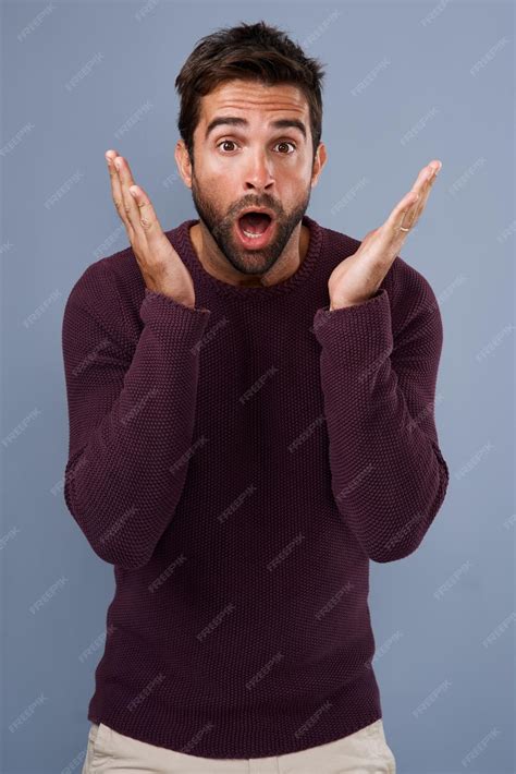 Premium Photo | Shocked portrait and man with hand gesture in studio