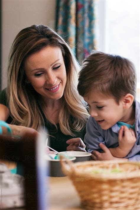 "Easter: Mother Helps Boy To Color Eggs" by Stocksy Contributor "Sean