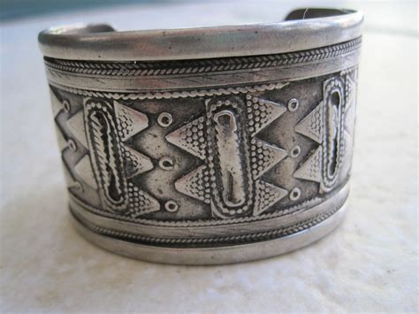Kazakhstan | Silver bracelet decorated in the typical geometric style ...