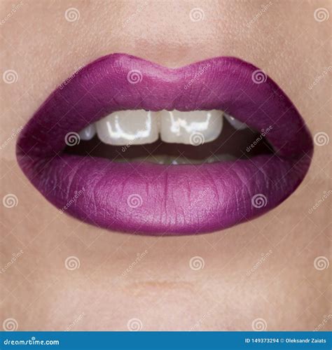 Close-up Macro Beautiful Lips with Purple Violet Mat Lipstick. Purple