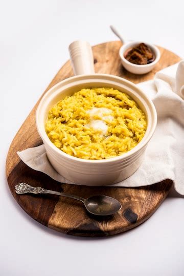 Premium Photo | Dal Khichdi Fry With Ghee served in a bowl