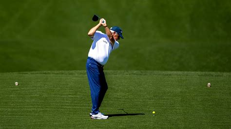 Masters champion Fred Couples of the United States plays a stroke from