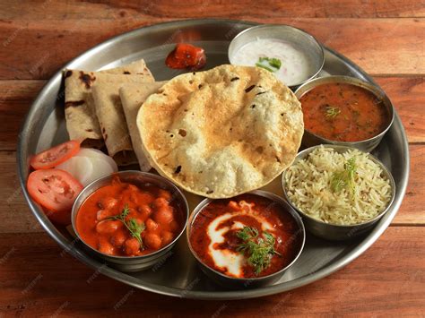 premium photo punjabi veg thali   indian cuisine food platter