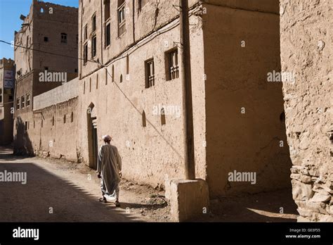 Man walking in the abandoned Al Hamra village, Oman Stock Photo - Alamy