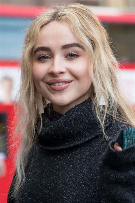 Download Sabrina Carpenter Smiling Portrait Wallpaper | Wallpapers.com