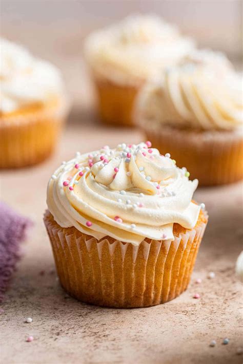 Download A classic cupcake topped with vibrant sprinkles | Wallpapers.com
