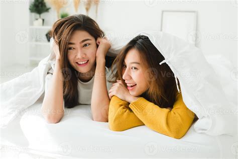 Top view of beautiful young asian women lesbian happy couple showing