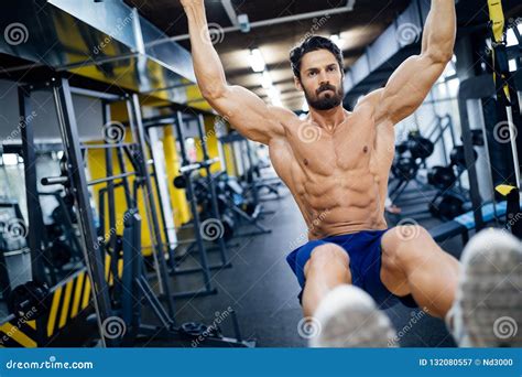 caucasian man exercising  suspension training trx stock image