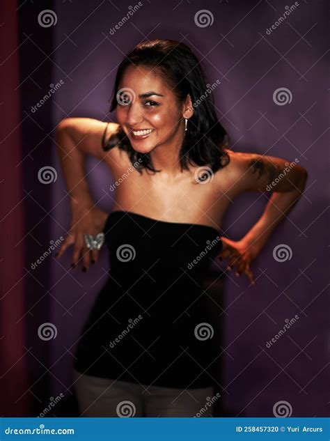 Feeling a Little Bit Frisky. Portrait of a Tipsy Girl about To Pull Her