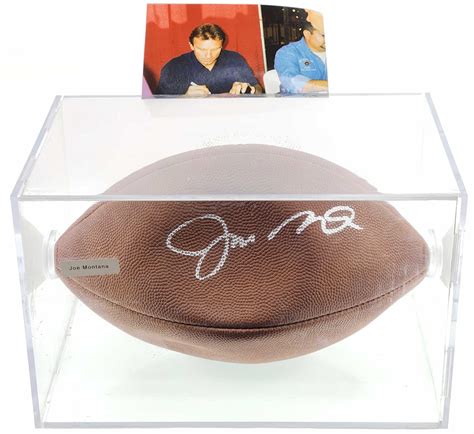 Lot - Joe Montana Autographed Football With Photograph