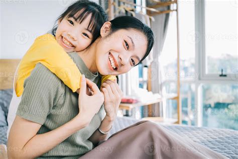Asian mother and daughter at home together 4797709 Stock Photo at Vecteezy