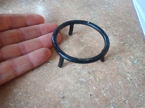 Found in kitchen drawer with other cooking tools, metal covered in