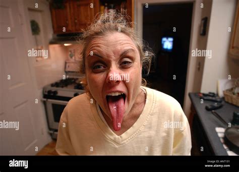 Funny woman with long tongue sticking out Stock Photo: 1405232 - Alamy