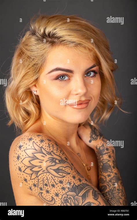 Portrait of beautiful woman with tattoos Stock Photo - Alamy