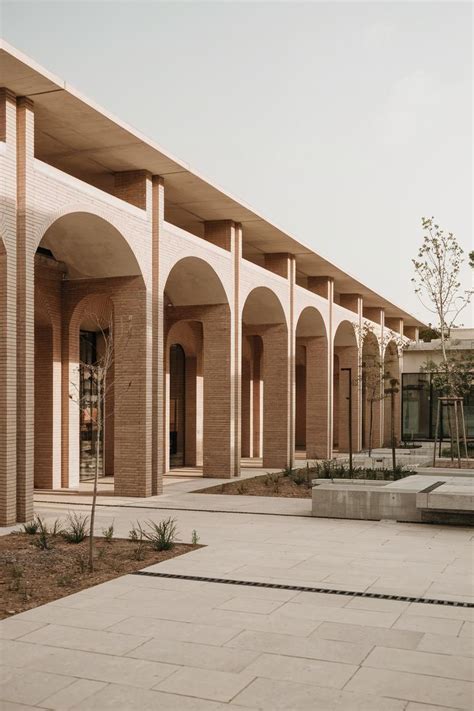 row  brick arches forming  corridor   contemporary setting