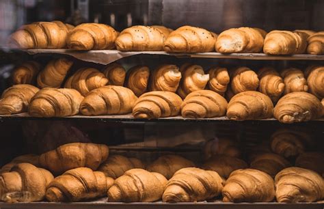 Premium Photo | French croissants on a showcase in a bakery shop