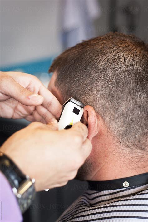 "Man Getting A Haircut." by Stocksy Contributor "Darren Muir" - Stocksy