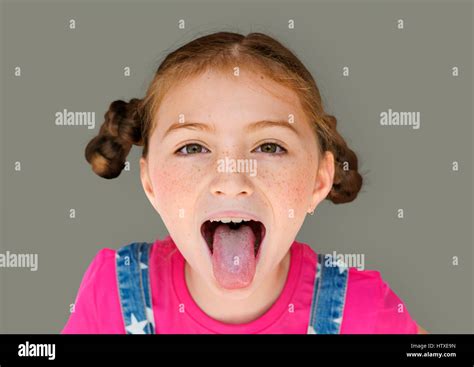 Little Girl Smiling Happiness Sticking Out Tongue Studio Portrait Stock Photo - Alamy