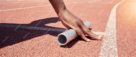 premium photo stadium start track athlete hands  relay ready