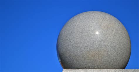 gray ball  gray surface  blue background  stock photo