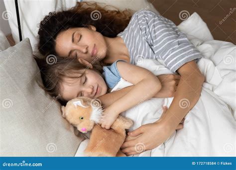Happy Young Tranquil Peaceful Woman Sleeping with Daughter Under