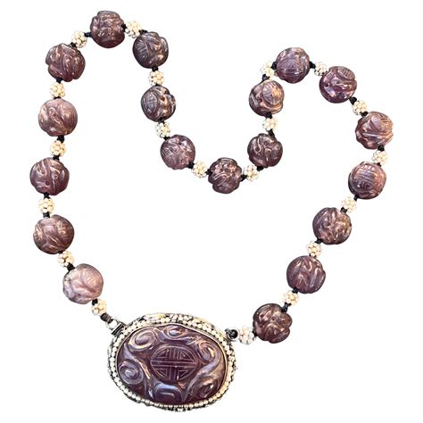 An Important Necklace of Chinese Carved Amber Beads at 1stDibs