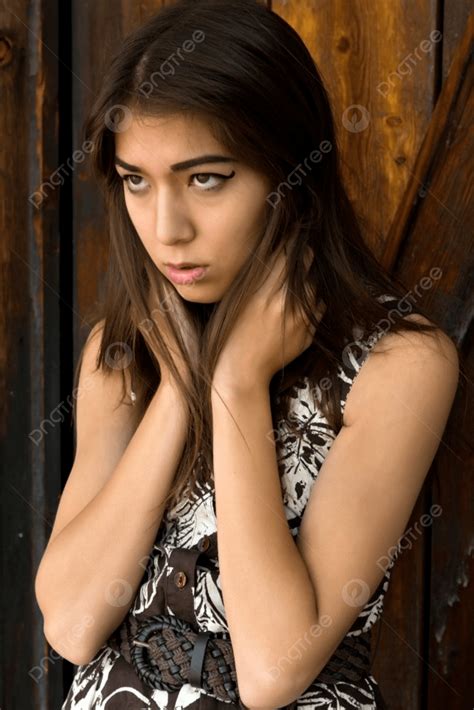 Beautiful Petite Eurasian Woman In A Print Dress Photo Background And