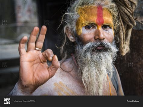 Close up of an Indian shaman showing ok sign stock photo - OFFSET