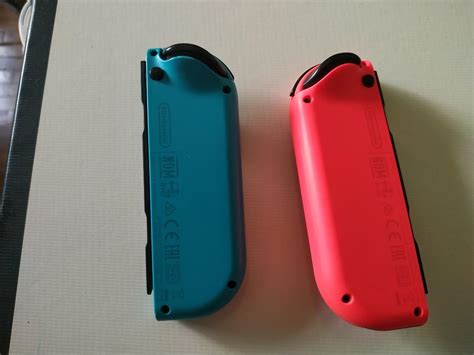Nintendo switch joycons- neon red and blue with silicon case, Video ...