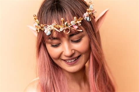 Premium Photo | Young elf woman with pink hair isolated on beige background