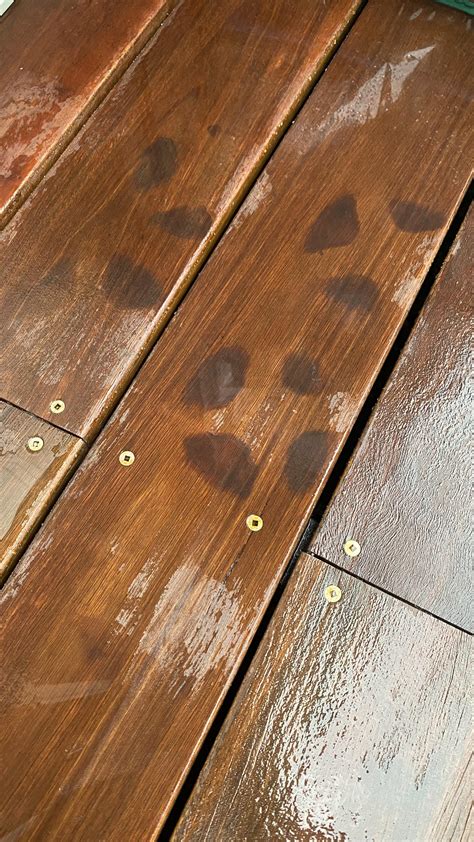 How do I remove these stains after leaving some plastic pots on my deck