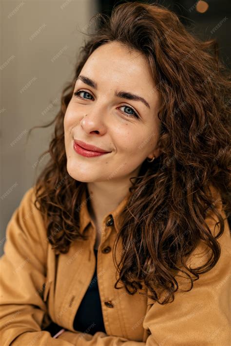 Free Photo | Close up portrait of tender lovely woman with curly hair