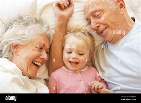 Family grandfather bed grandchild hi-res stock photography and images ...