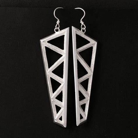 tufa cast earrings  tim herrera rainmaker gallery