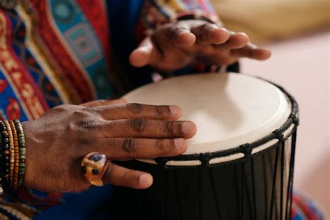 Close-Up Photo Of Person Playing Djembe · Free Stock Photo