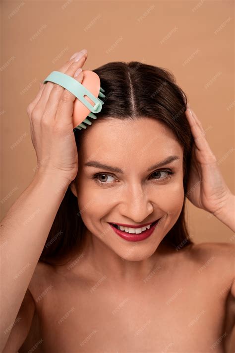 Premium Photo | Woman giving themselves scalp massage