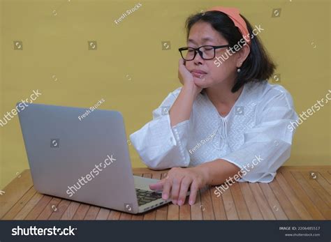 woman sitting staring  computer  stock photo