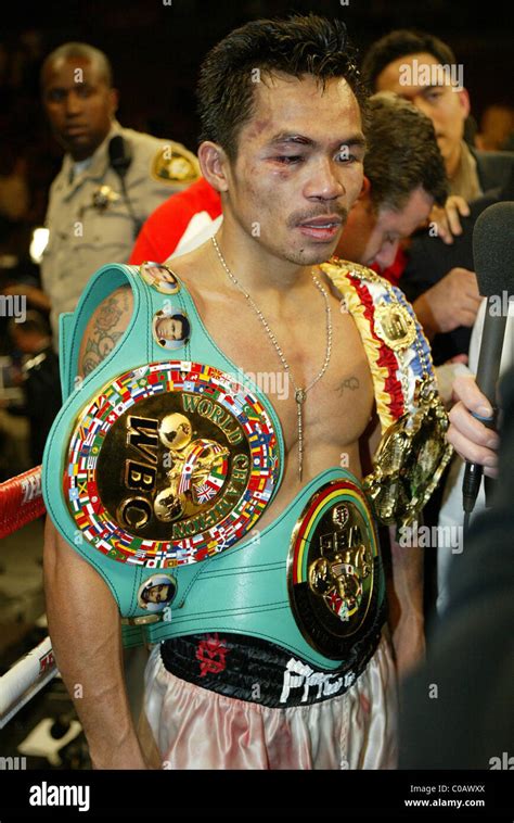 Manny Pacquiao with his Championship belts. Pacquiao won the WBC and ...
