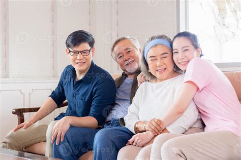 Cheerful Asian family in living room, Senior father mother and middle